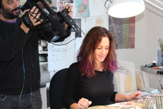 KQED - KQED Producer Matthew Williams films artist Wendy MacNaughton at her drawing table.JPG